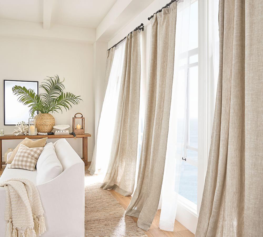 Sun-lit corner with linen curtains and styled console